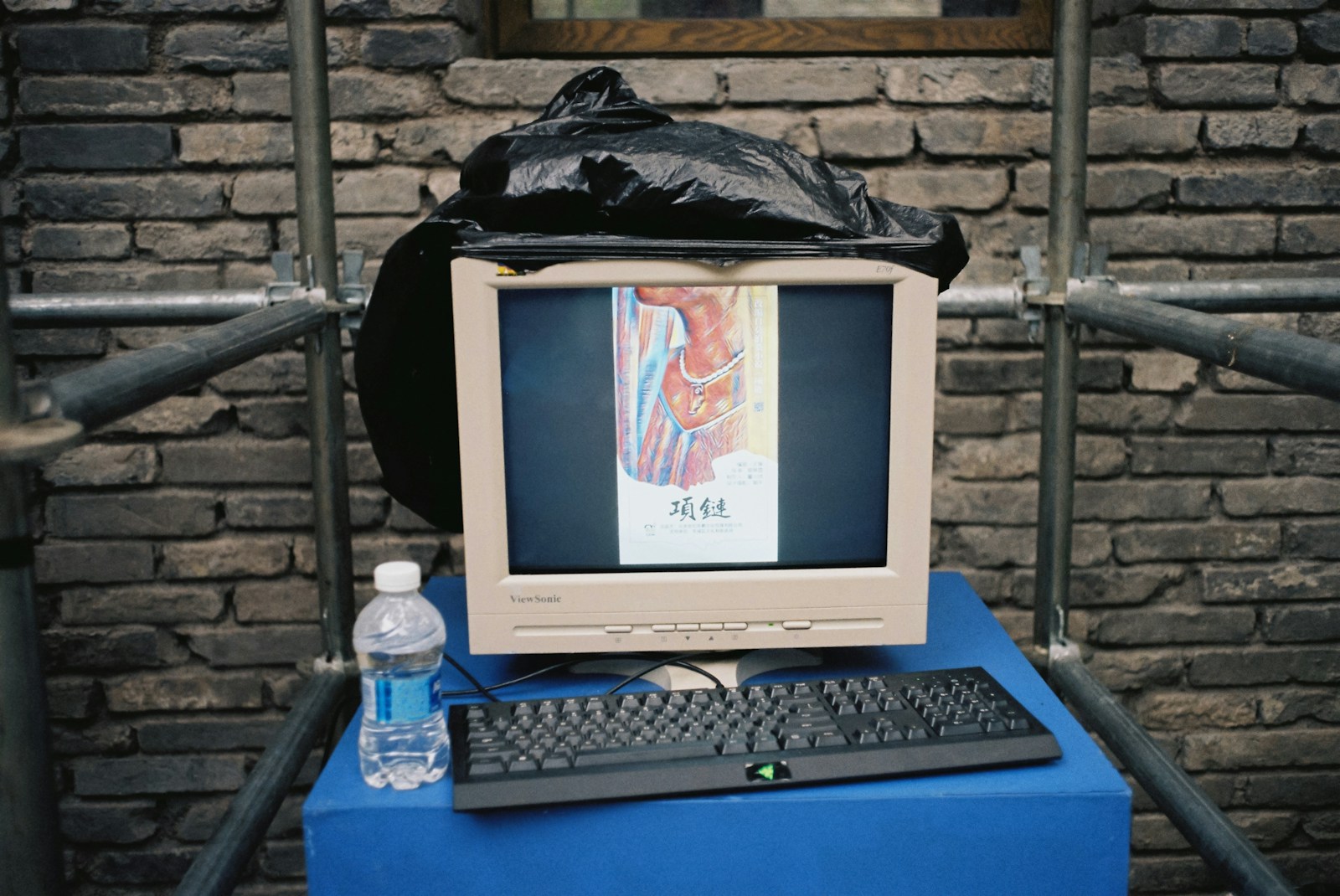 white crt computer monitor on blue table
