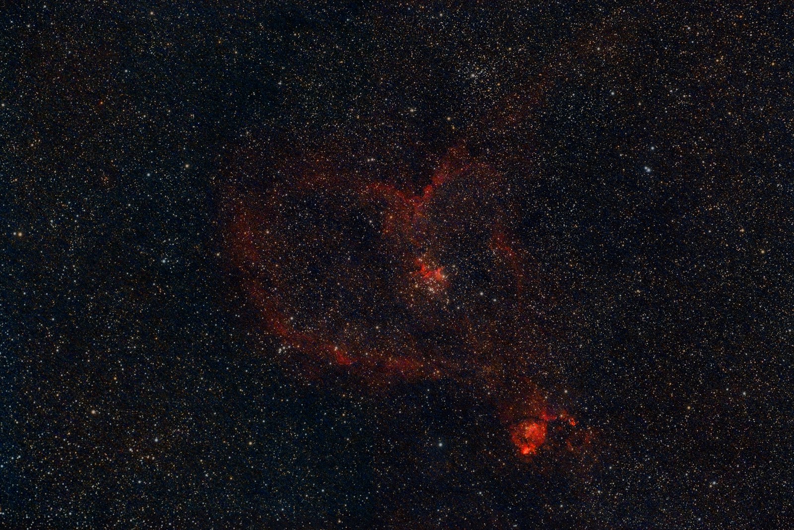 Red nebula in the starry night sky.