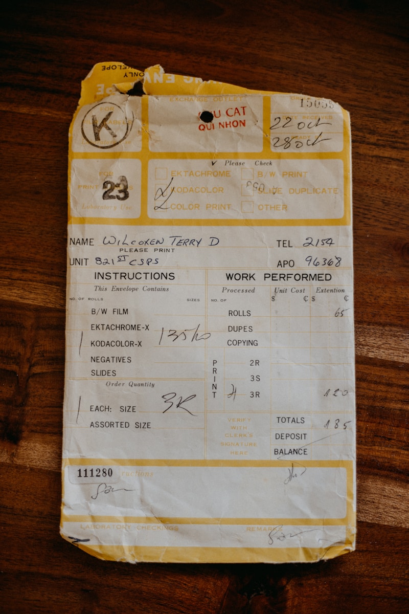 A receipt sitting on top of a wooden table